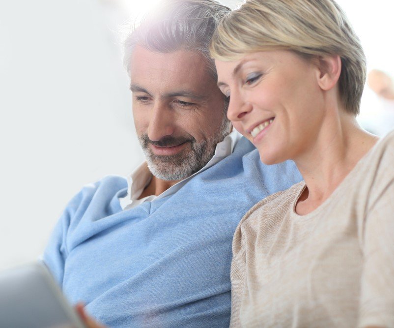 Senior couple reviewing insurance documents